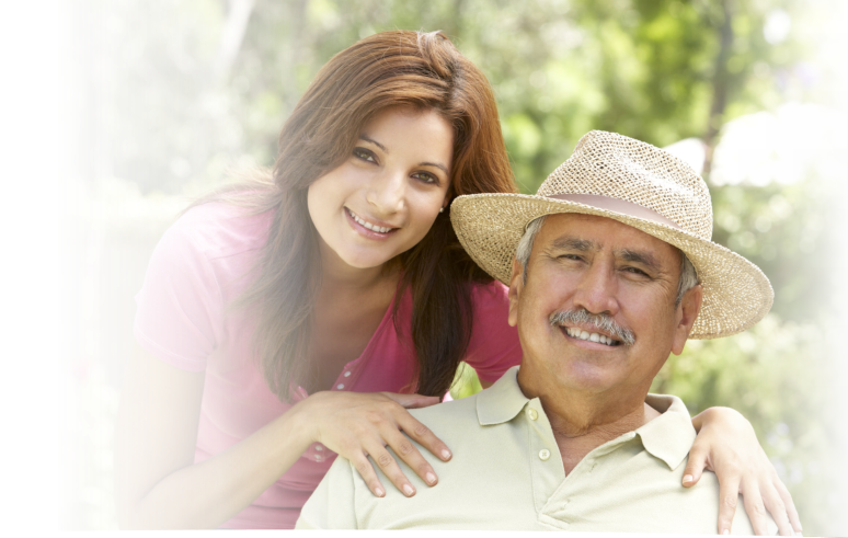 father sitting with his daughter behind him